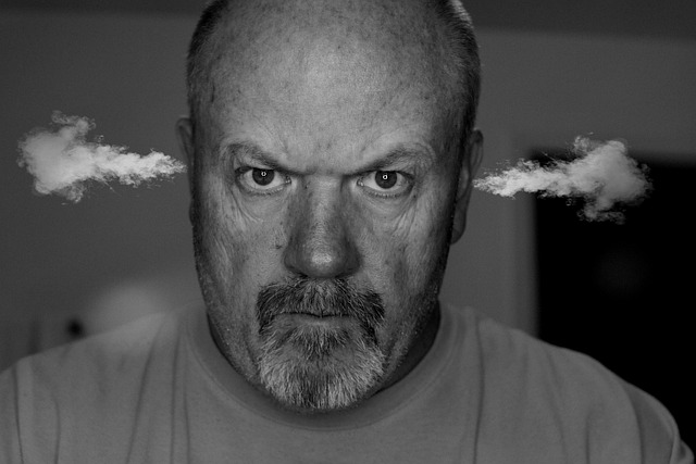 Image of a man stressed and angry with steam coming out of his ears.